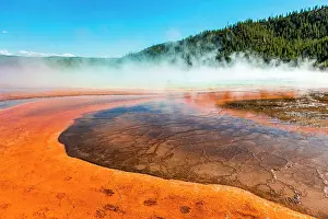 Prismatic: Colored mineral deposits at the edge of the steaming