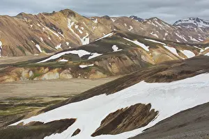Remains: Colored rhyolite mountains with remains of snow