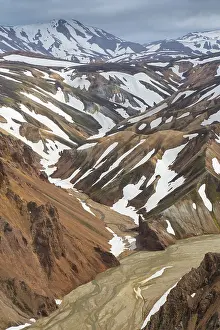 Remains: Colored rhyolite mountains with remains of snow