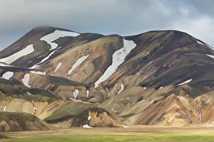 Remains: Colored rhyolite mountains with remains of snow