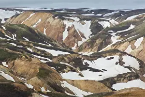 Remains: Colored rhyolite mountains with remains of snow