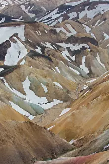 Remains: Colored rhyolite mountains with remains of snow