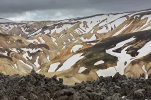 Remains: Colored rhyolite mountains with remains of snow