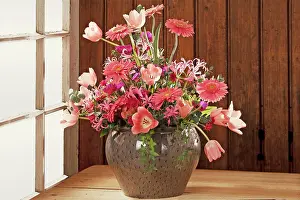 Multi: Colorful bouquet in a vase against a wooden wall