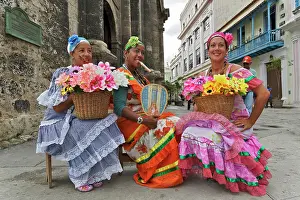 Cigar: Colorful Cuban lady with cigar and flowers