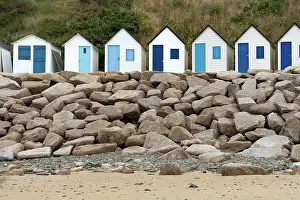 Cottages: colorful row of small wooden beach cottages on the