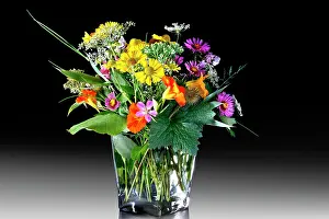 Vase: Colourful bouquet of wild flowers in a glass vase