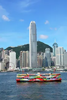 Crossing: Colourful Ferry crossing Victoria Harbour and Skyline, Hong