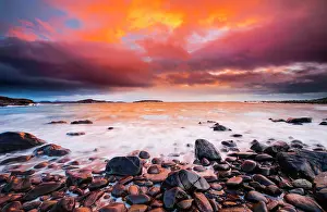 Stony: Colourful sunset on a stone beach near Achiltibuie
