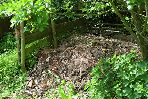 Made: A compost heap made with wooden planks and posts