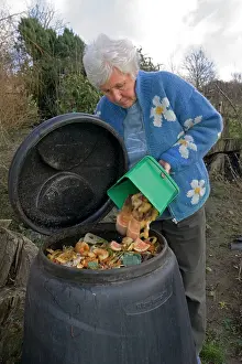 Compost: Compost - woman tipping variety of kitchen waste