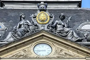 Statue: Copenhagen, Denmark. Clock tower, royal coat of arms