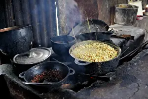 Poverty: Corn being cooked for the preparation of traditional