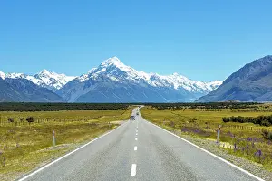 Cook: Country road overlooking snow-capped Mount Cook