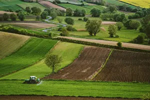 Polish: Countryside, tractor, spraying fertiliser, fields