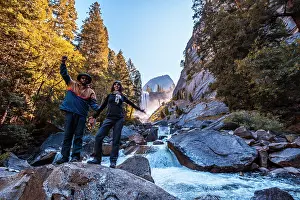 Caucasian: A couple in Vernal Falls waterfall of Yosemite N