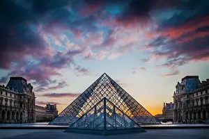 Triangle: Courtyard of Musee du Louvre at sunset