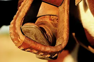 Riding: Cowboy boots in stirrups