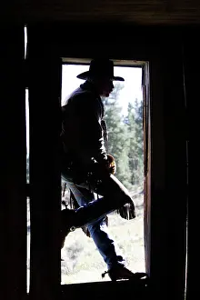 Ranches: Cowboy - silhouetted in door frame