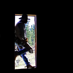 Ranches: Cowboy - silhouetted in door frame