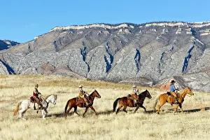 Cowboys: Cowboys - family riding on Quarter Horses