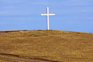 Fuego: Cross - a giant cross mounted on a hill in the