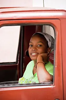 Vans: Cuba - Young woman in a delivery van in Habana