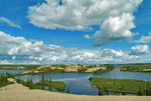 Janis: Cumulus clouds float above lakes, Northwest