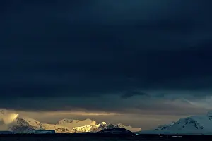 Cuverville: Dark sky over mountains
