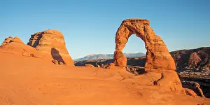 Arches: Delicate Arch rock arch in the evening sun, Arches