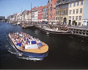 Canals: Denmark, Cophenhagen - tourists on river boat