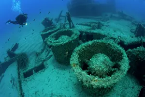 Scenics: Diver exploring the stern of the LST 349, a British Landing