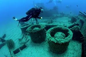 Scenics: Diver exploring the stern of the LST 349, a British Landing