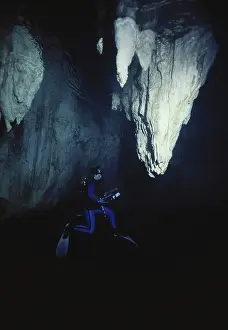 Dripstone: Diver in Underwater Cave