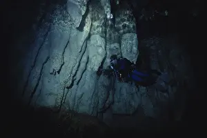 Dripstone: Diver in Underwater Cave