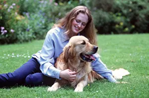 Stroking: DOG - Girl sitting with Labrador Retriever