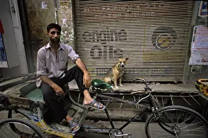 Scooter: Dog and man on a scooter Varanaci India