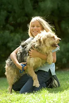 Stroking: Dog - Mongrel on girl's lap
