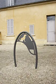 Towns: Dog parking in front of a grocers France