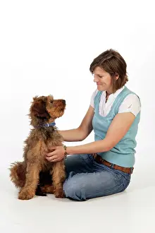 Brie: Dog - Puppy (Briard) & owner looking lovingly at each other