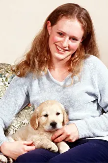 Sofa: DOG - PUPPY - GIRL CUDDLING
