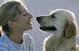 Choosing: DOG - RETRIEVER and GIRL - facing each other