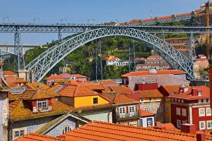 Roofs: The Dom Luis I metal arch bridge and orange tiled