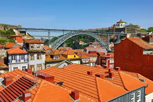Roofs: The Dom Luis I metal arch bridge and orange tiled