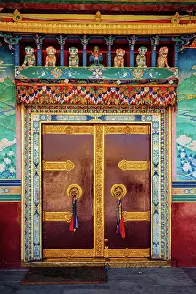 Pradesh: Door gate in Buddhist monastery. Mud village, Pi