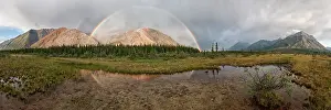 Rainbows: Double Rainbow over coloured mountains Boreal Forest