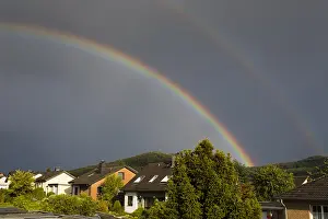 Storms: Double Rainbow - during summer storm, over residential