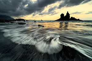 Gloomy: Dramatic cloud atmosphere with rock formation at