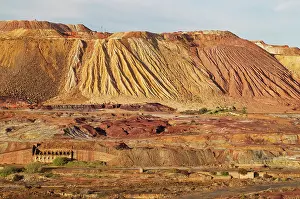 Mines: Dramatic landscape of mineral-rich ground and rock sca
