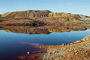 Mines: Dramatic landscape of mineral-rich ground and rock sca